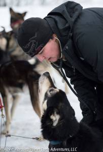 A dog gets a vet check the day before the race. [Photo by Albert Marquez/Planet Earth Adventures]