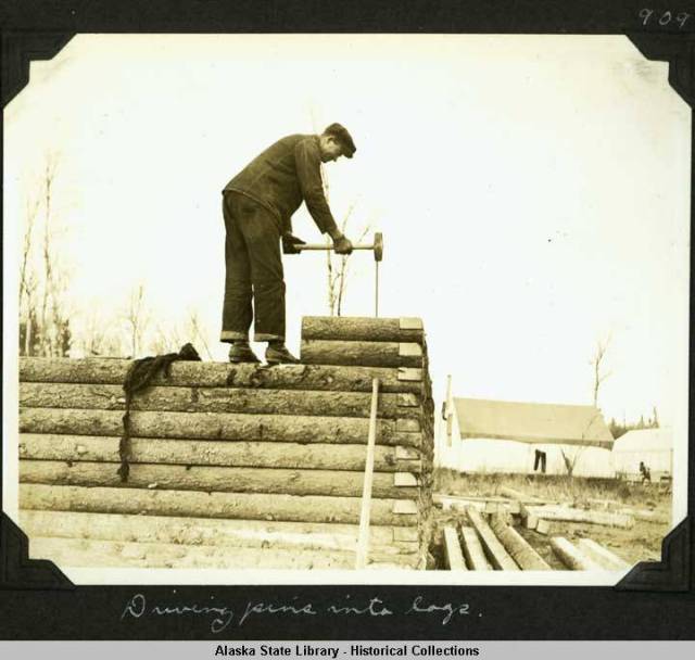 Driving pins into log walls [Willis T. Geisman, 1935]