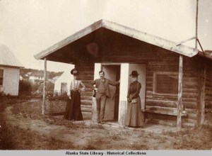 Mr. and Mrs. Wickersham (right) and woman friend in front of the Eagle cabin built by Judge Wickersham in 1900. [Alaska State Library P277-019-022]